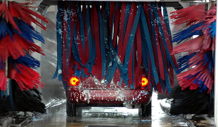 Interior car wash bay pressure washing